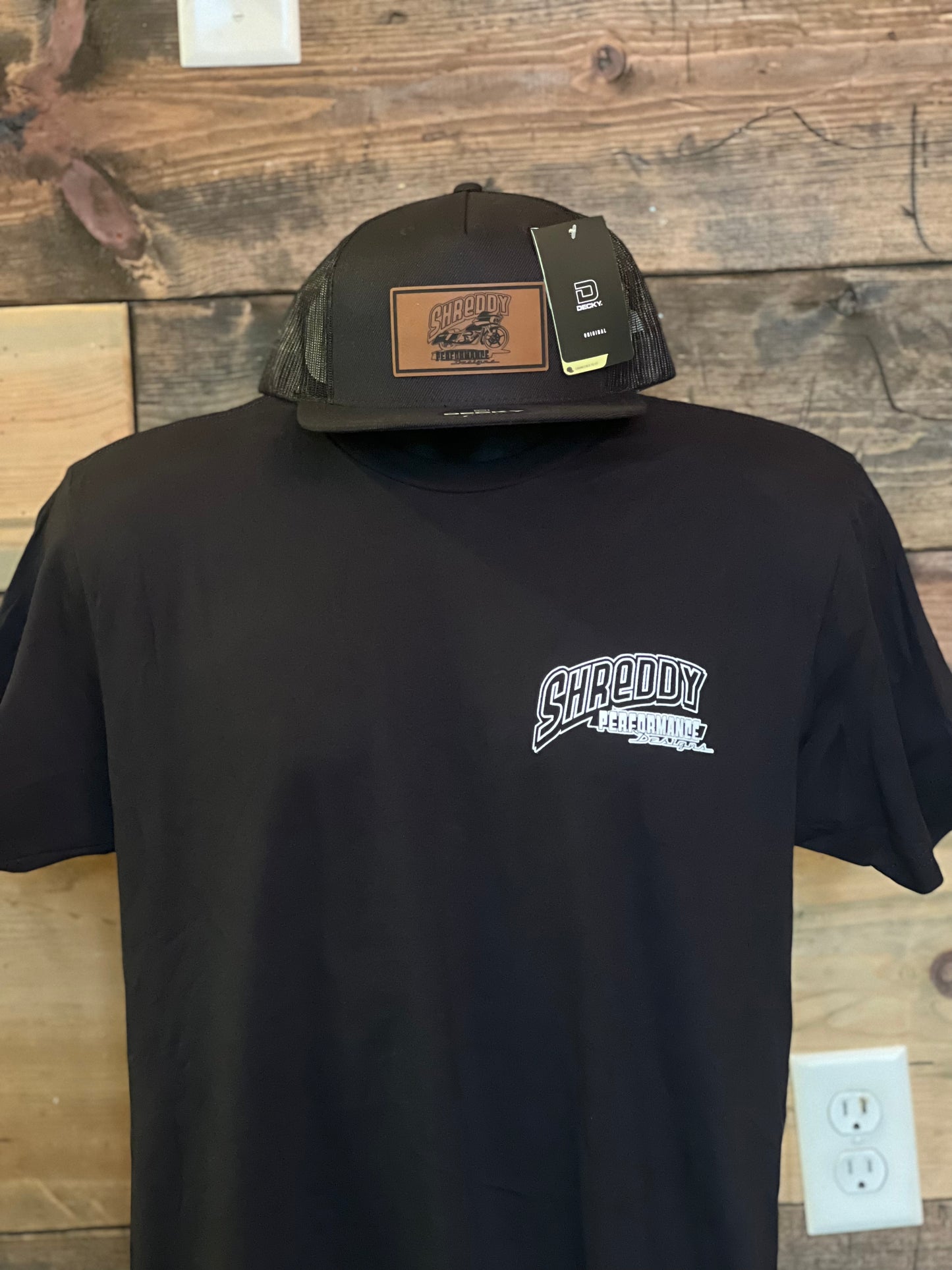 All Black Shreddy Leather Patch Trucker Hat